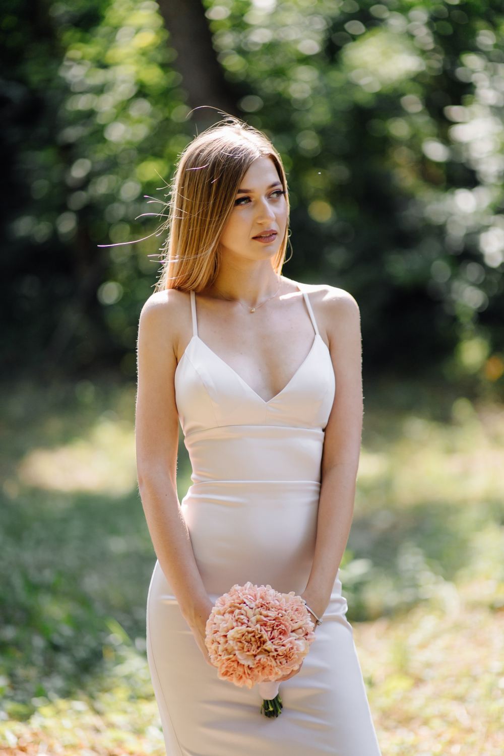Woman wearing v-neck bridesmaid dress