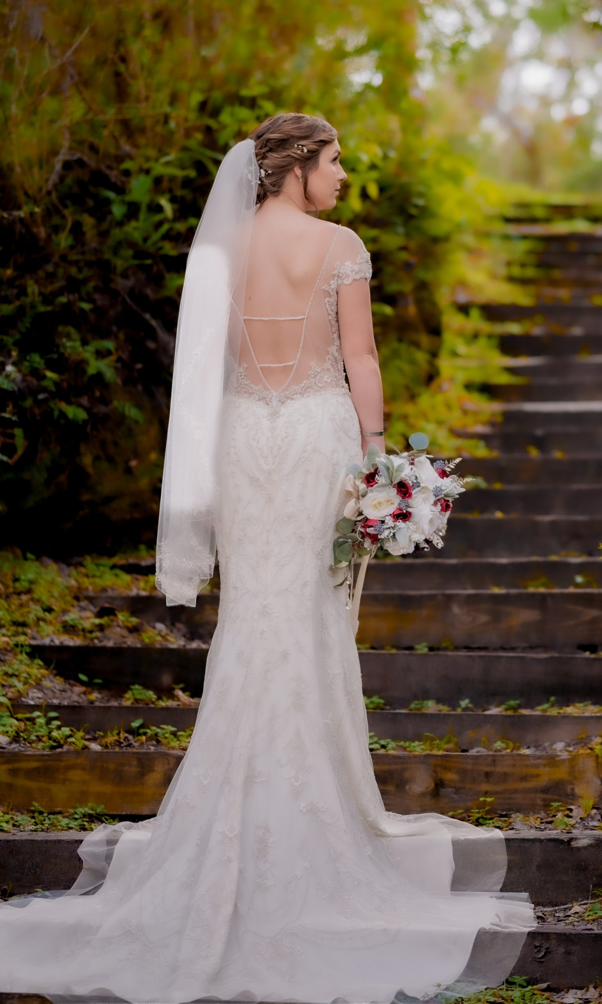 bride holding flowers in hand at a photoshoot